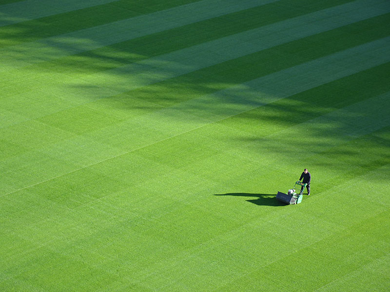 Mowing Football Pitch with lawnmower