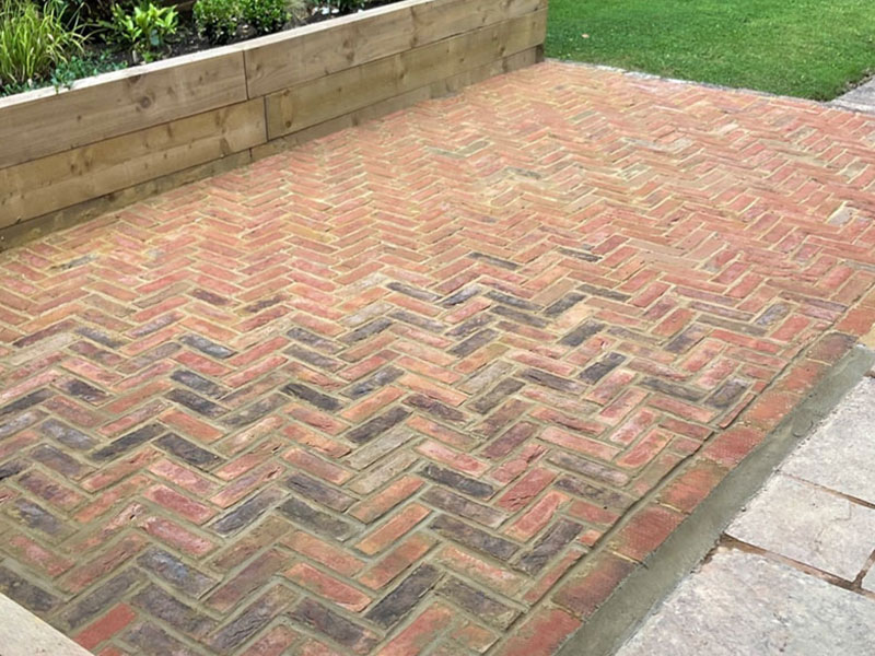 Herringbone natural brick patio installed by CS Gardens